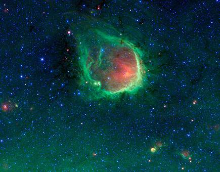 El telescopio Spitzer espa una burbuja esmeralda deslumbrante en el espacio